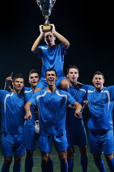 soccer players celebrating victory photo