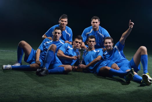 soccer players celebrating victory photo