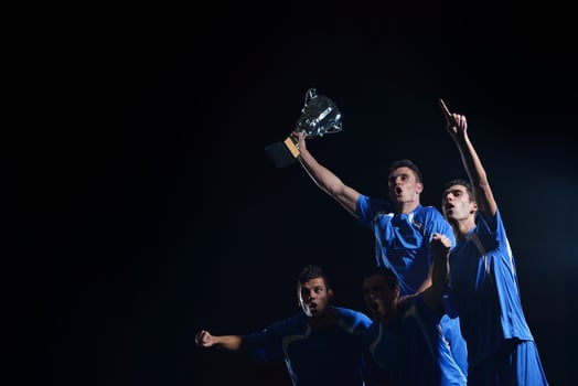 soccer players celebrating victory photo