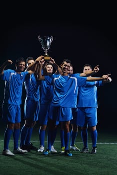 soccer players celebrating victory photo