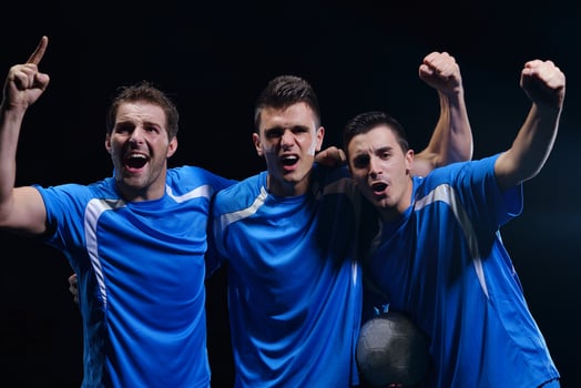 soccer players celebrating victory photo