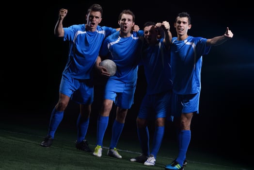 soccer players celebrating victory photo
