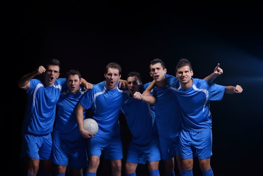 soccer players celebrating victory photo