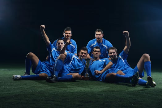 soccer players celebrating victory photo