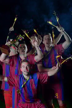 soccer players celebrating victory photo