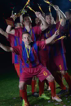 soccer players celebrating victory photo