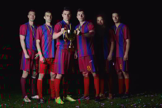 soccer players celebrating victory photo