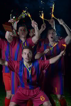 soccer players celebrating victory photo