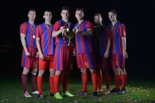 soccer players celebrating victory photo