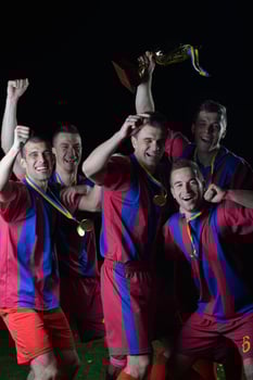 soccer players celebrating victory photo