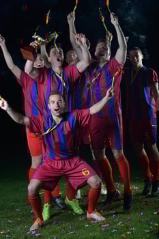 soccer players celebrating victory photo