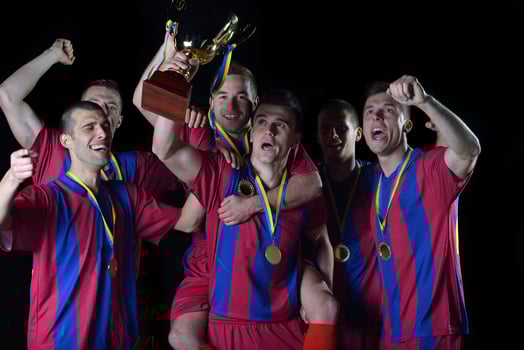soccer players celebrating victory photo