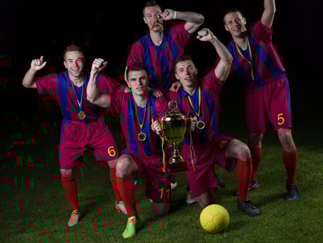 soccer players celebrating victory photo