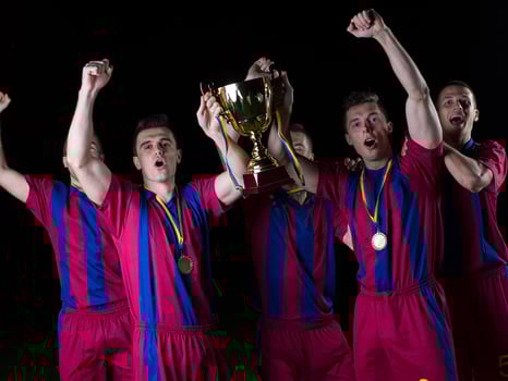 soccer players celebrating victory photo