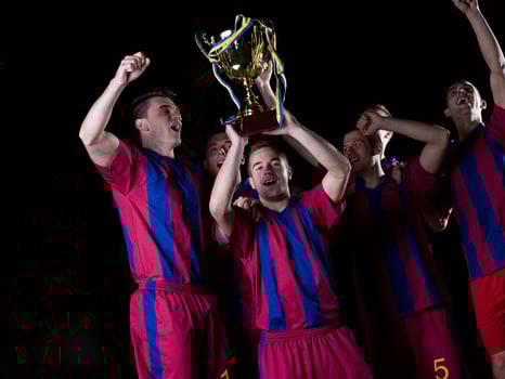 soccer players celebrating victory photo