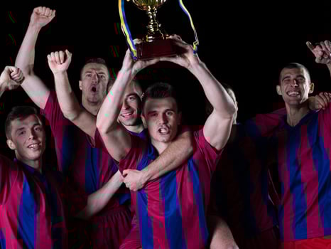 soccer players celebrating victory photo