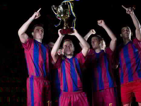 soccer players celebrating victory photo