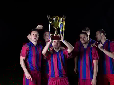 soccer players celebrating victory photo