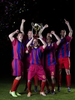 soccer players celebrating victory photo
