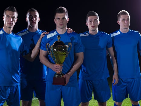 soccer players celebrating victory photo