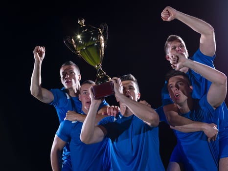 soccer players celebrating victory photo