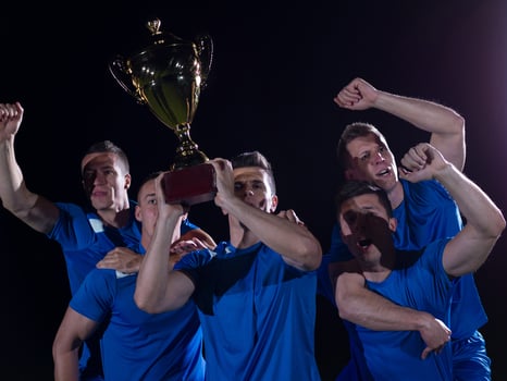 soccer players celebrating victory photo