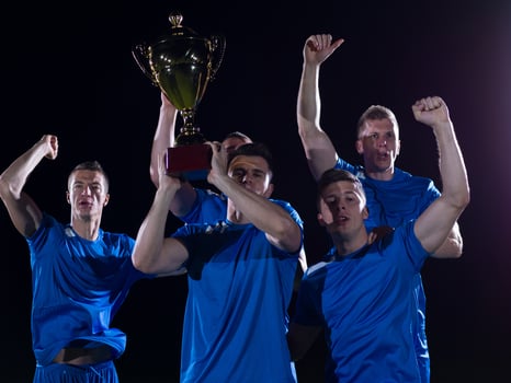 soccer players celebrating victory photo