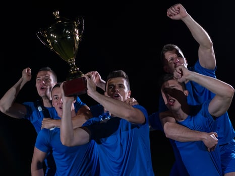 soccer players celebrating victory photo
