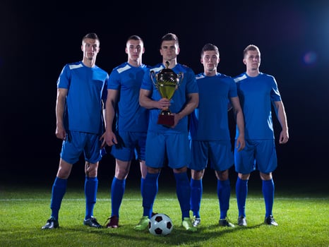 soccer players celebrating victory photo