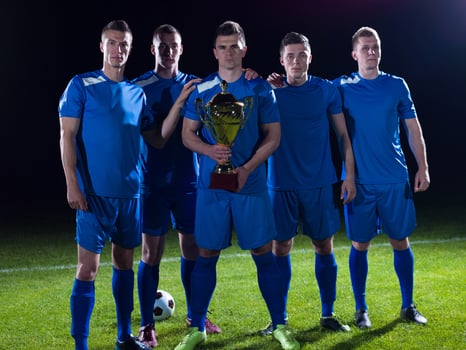 soccer players celebrating victory photo