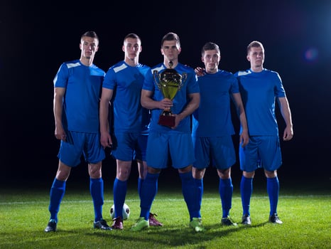 soccer players celebrating victory photo