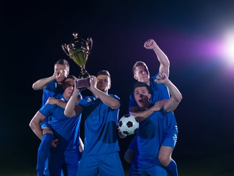 soccer players celebrating victory photo