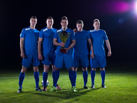 soccer players celebrating victory photo