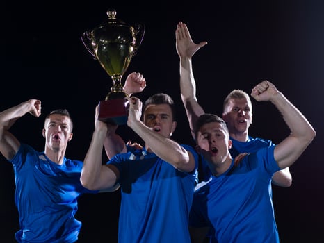 soccer players celebrating victory photo