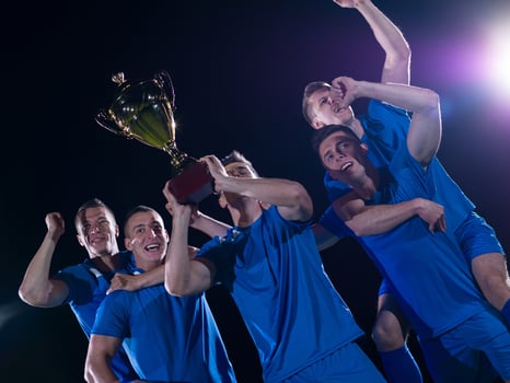 soccer players celebrating victory photo