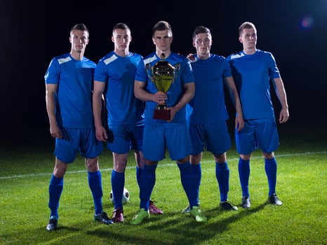 soccer players celebrating victory photo