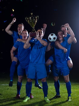 soccer players celebrating victory photo