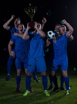 soccer players celebrating victory photo