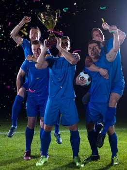 soccer players celebrating victory photo