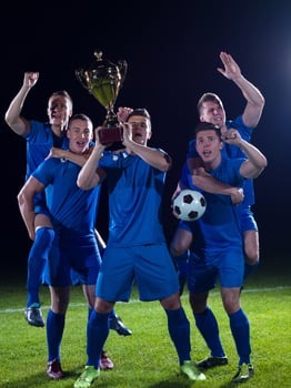soccer players celebrating victory photo