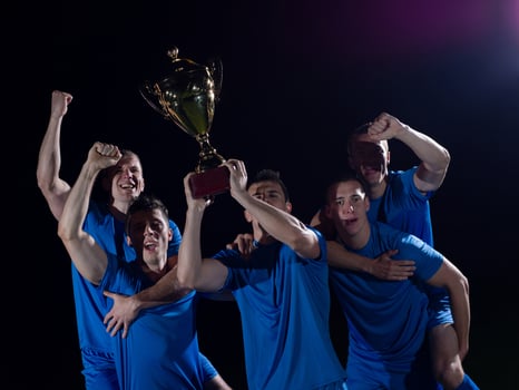 soccer players celebrating victory photo