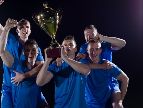 soccer players celebrating victory photo