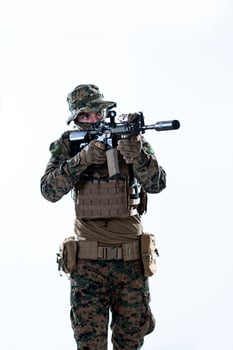 soldier in action aiming laseer sight optics photo
