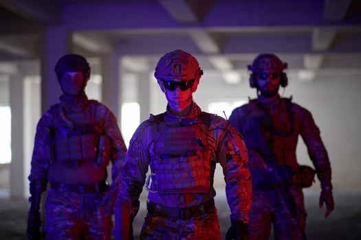 soldier squad team portrait in urban environment colored lightis photo