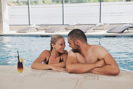 happy cople relaxing  at swimming pool photo