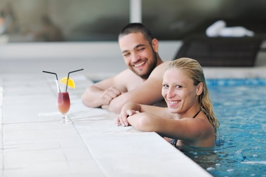 happy cople relaxing  at swimming pool photo