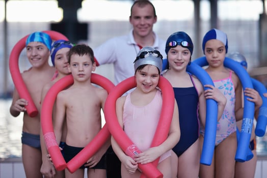 happy children group  at swimming pool photo