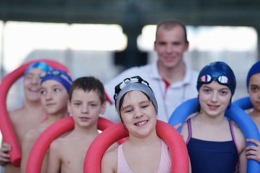 happy children group  at swimming pool photo
