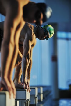 young swimmmer on swimming start photo