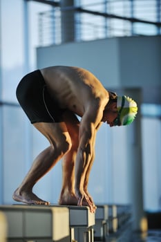 young swimmmer on swimming start photo